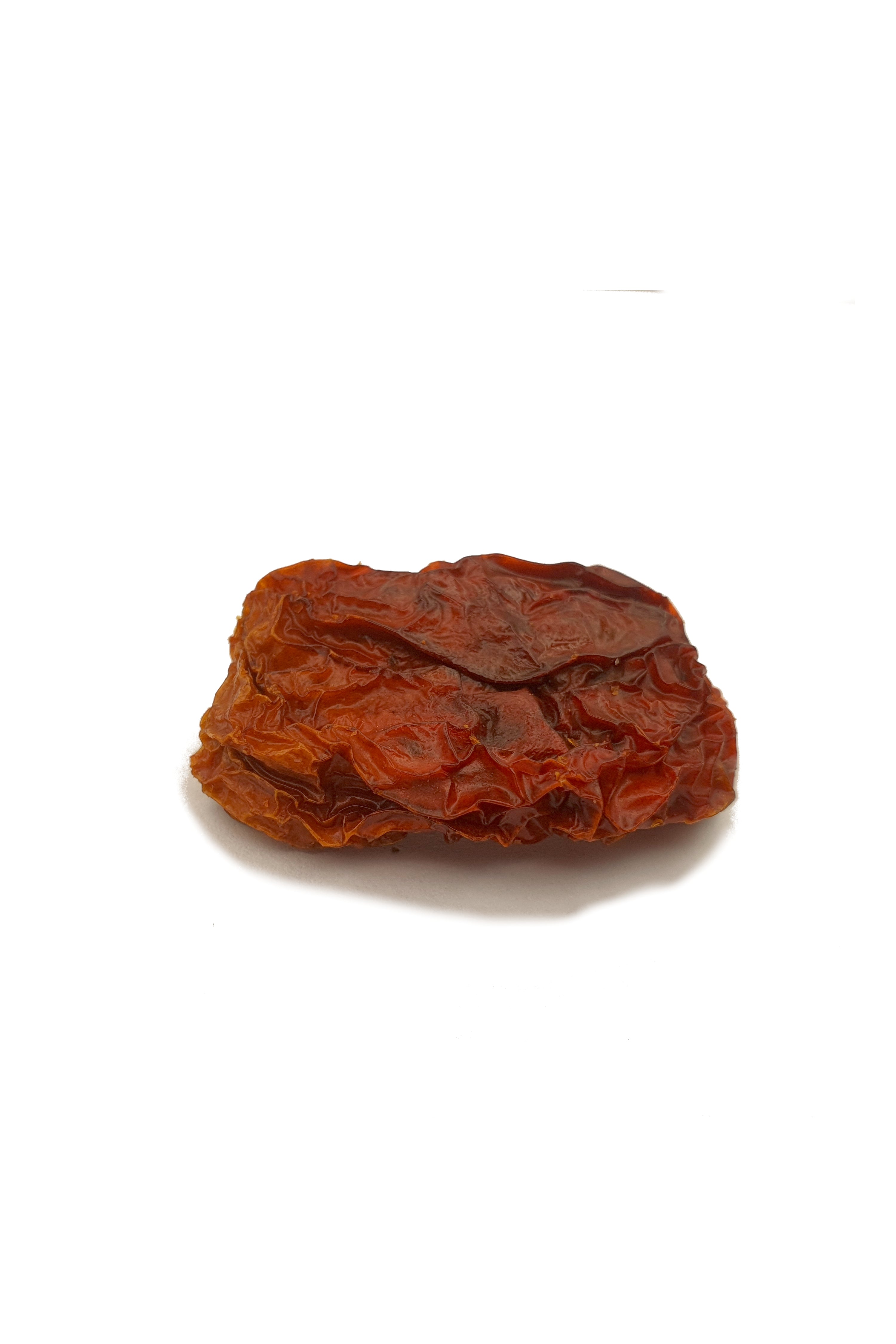 Knabba Baba eine Detailaufnahme von Getrockneten Tomaten auf weißem Hintergrund